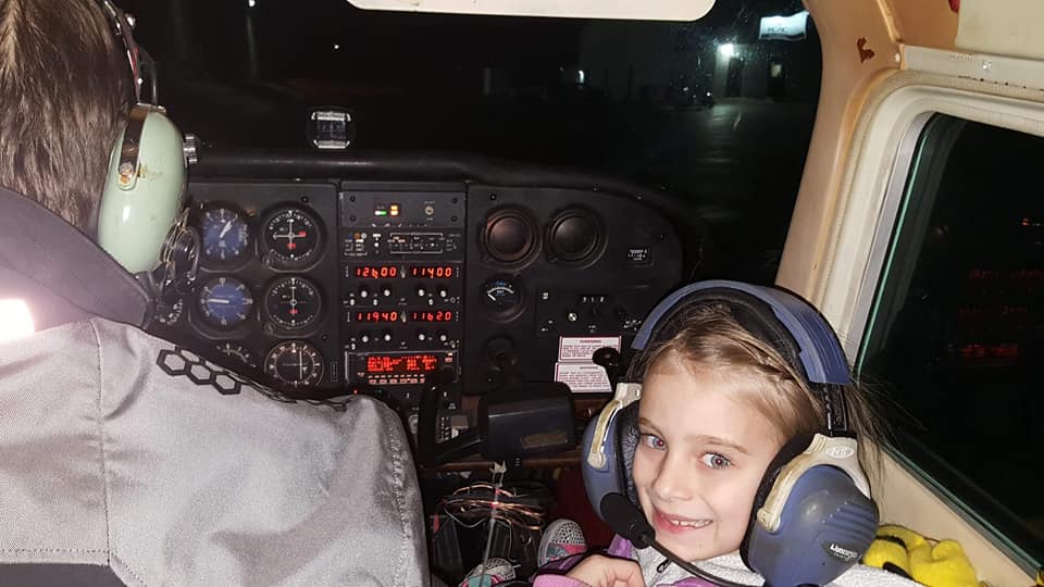 Flying Over Christmas Lights in Small Airplane